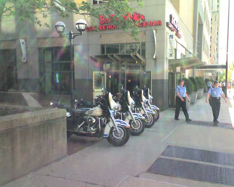 4 Dayton Police Motorcycles parked on the sidewalk outside Boston Stoker