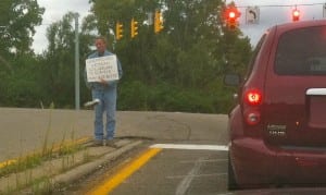 Panhandling with a sign in Riverside