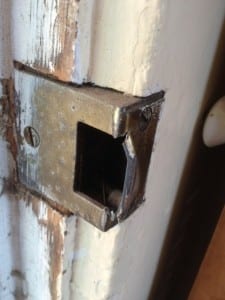 The busted door jamb after the break in.