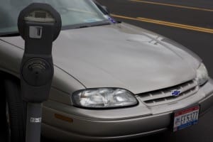 Matt Joseph parks at expired meter and sticks his free parking card