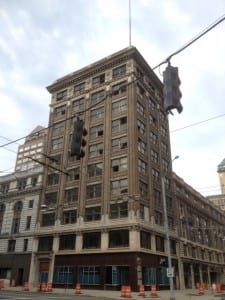 Photo of the SW corner of the Arcade complex with the windows fallen out