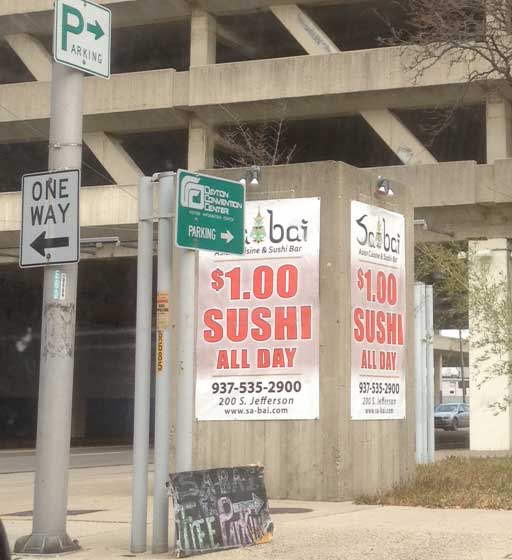 Sa Bai offering $1 sushi Sabai banner offering $1 sushi- a sure sign of impending closure