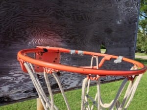 Esrati hangs nets on Rims at Mallory Park in Dayton Ohio