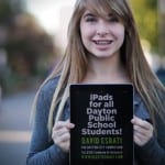 Photo of Maya White, holding an iPad, promoting the campaign of David Esrati for Dayton City Commission and iPads for Dayton Public Schools students.